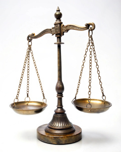 antique scales of justice on white background