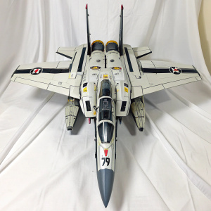 Custom VF-1S Valkyrie model from Macross franchise. White, gray, and black color scheme. Highly detailed and futuristic. Displayed on a white backdrop.