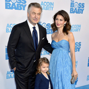 Alec Baldwin, Carmen Gabriela Baldwin, Rafael Thomas Baldwin, and Hilaria Baldwin on the blue carpet at the premiere of 'The Boss Baby'. All dressed formally.