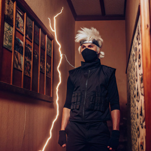Kakashi Hatake from Naruto series. Wearing black vest, mask covering lower face, white hair, standing against dynamic, colorful manga backdrop.
