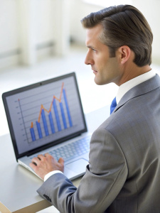 Cropped photo of businessman analyzing business diagram, marketing statistics and finance market graphs on laptop monitor in the office