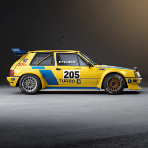 Concept art of a sleek Peugeot 205 Turbo 16 rally car, race-ready. Bright yellow and blue with numerous decals and sponsor logos. Number 205 prominently displayed.