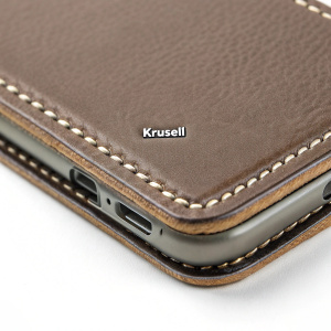 Close-up of a Krusell iPhone wallet case, showcasing the detailed stitching and brand name logo.