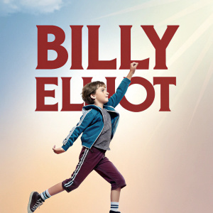 Promotional poster for Billy Elliot. A young boy in athletic pose. Bold text 'Billy Elliot'