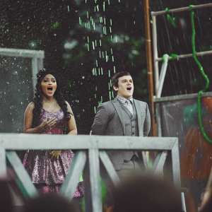 Nicki Minaj and Josh Hutcherson hosting the glitzy Nickelodeon Kids' Choice Awards. Multicolored slime backdrop