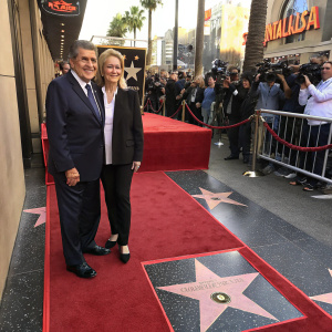Haim Saban and Phyllis Tucker Vinson Jackson at a star-studded Hollywood event. They stand proudly beside their stars on the Walk of Fame.