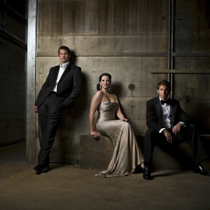 Thomas Roberts, Lynda Carter, Patrick Abner, attending the GLAAD Media Awards. Wearing formal attire, against blue backdrop.