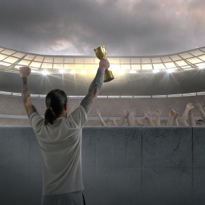 Antoine Griezmann, with ponytail and arm tattoos, celebrating match win. Stadium crowd cheering in background.