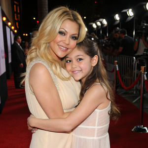 Shanna Moakler and her daughter Atiana Cecilia de la Hoya at a Hollywood charity event. Wearing matching outfits, hugging each other.