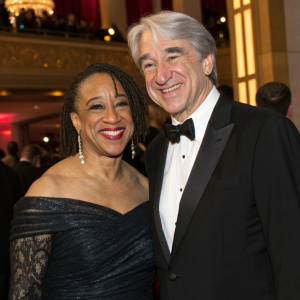 S. Epatha Merkerson and Sam Waterston at the Academy Awards after-party. Smiling and dressed in formal attire.