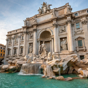 In the heart of Rome, the stunning Trevi Fountain stands as a testament to Baroque architecture. Created by Nicola Salvi and completed by Pietro Bacci, this iconic landmark is made of white travertine stone, adorned with an array of sculptures depicting mythological and historical characters. At its center, a vibrant display of meticulously crafted statues captures the essence of the fountain's grandeur, enveloped in intricate details and rich textures, showcased in a lifelike manner that celebrates its magnificent design.