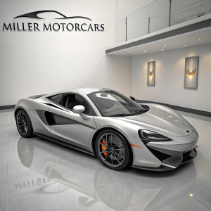 Sleek silver McLaren 570S on pristine showroom floor. Miller Motorcars logo boldly displayed on pristine white wall behind.
