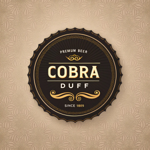 Vintage premium beer label, COBRA DUFF, since 1805. Dark brown background, bold gold font, sophisticated circular design, featuring 'Premium Beer', 'COBRA', 'DUFF', and 'Since 1805'