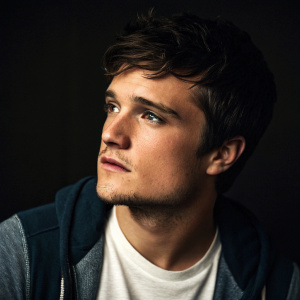 Josh Hutcherson featured in a candid photo shoot for an entertainment magazine. Intense gaze, dark background