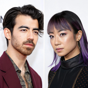 Serious portraits of Joe Jonas and JinJoo Lee. Joe Jonas with a beard and dark hair, JinJoo Lee with sleek purple-highlighted hairstyle. Against plain white backdrop.