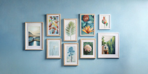 Multiple poster mockup frame and clear image hanging on light blue wall
