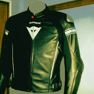 Dainese Super Speed C2 Jacket in black. White triangle logo and brand name clearly visible. High-quality leather material.