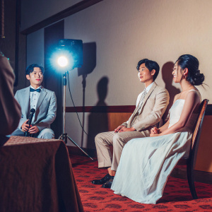 Kim Jae-Wook, Jin Se-Yeon, and Kim Hyun-Joong attending a Q&A session. Bright studio lights illuminate the room.