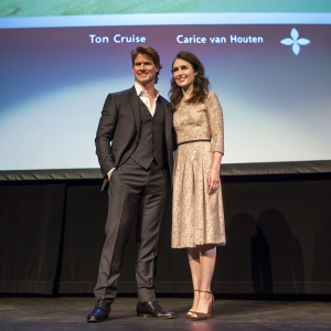 Tom Cruise and Carice van Houten attend film festival. Halina Reijn joins on stage. Projector screen displays film title