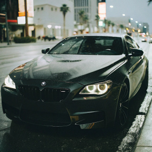 BMW M6 convertible on the streets of Las Vegas at night, headlights on, sleek and modern design
