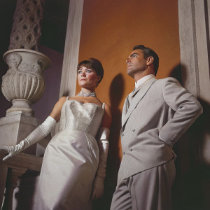 Black and white photograph of Shirley MacLaine and Jack Hawkins from the classic 1961 film 'Two Loves', standing against a vintage backdrop.