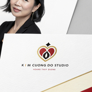 Professional business card series for Kim Cuong Do Studio. Portrait of Vietnamese woman Hoang Thuy Duong. Stylish heart-shaped logo in red, black, and gold. Clean, modern design with text in Vietnamese.