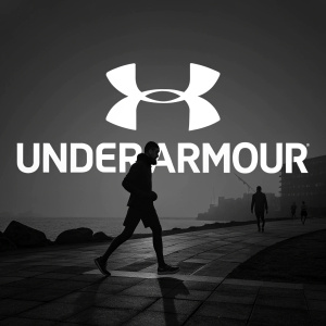 Under Armour brand logo, featuring bold, white text on a sleek black background. Modern font, minimalist design.