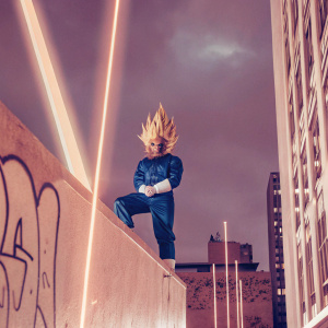 Digital illustration of Majin Vegeta from Dragon Ball series. Blue outfit, spiky hairstyle. Posed against a vibrant, dark urban backdrop with neon lights and graffiti.