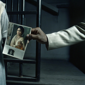 Website dedicated to the film 'Ghar Ka Pata'. Features a collage of vintage photographs, a close-up of a hand holding an old photo, and a picture of a woman in traditional attire. Includes detailed information about the movie and its director.