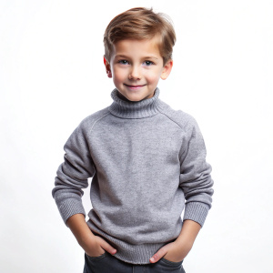 fashion portrait of handsome childer in gray pullover poses on a white background
