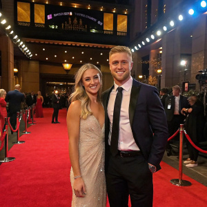 Cameron Munster and Bianca McMahon at the Dally M Awards. Smiling on the red carpet.