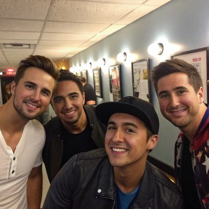 Casual snap of James Maslow, Carlos Pena, Kendall Schmidt, and Logan Henderson hanging out backstage at a concert.