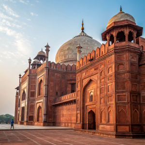 Red Fort in Delhi, India. Architectural marvel. Large domes and walls made of red sandstone, intricate carvings, and beautiful archways.
