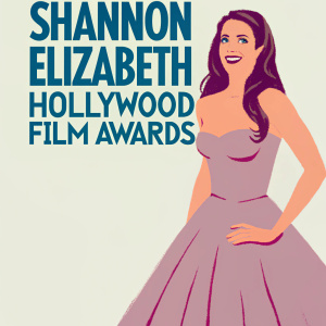 Shannon Elizabeth at the Hollywood Film Awards. Wearing a sophisticated, strapless silver gown with a flowing skirt. Her long brown hair is styled in soft waves. Warm smile. Against a stark white background with bold logos and event name