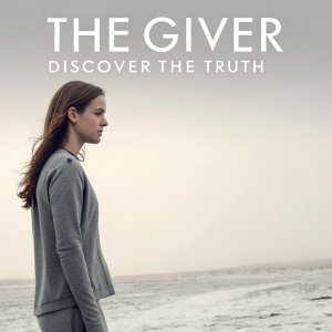 Movie poster for 'The Giver', featuring a woman with long brown hair, standing in a bleak, monochrome landscape.