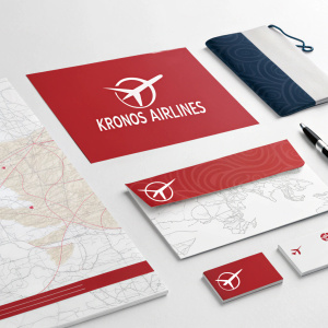 Promotional materials for Kronos Airlines. Airplane logo stationery, map, business card, and small promotional items featuring sleek, modern design with red banners.