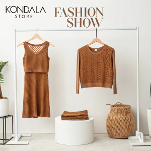 Kondala store's new collection showcased. Elegant brown knitted crop top paired with a smaller matching top. Fashion show backdrop, minimalist setting