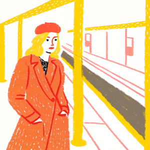 Jane Krakowski as Jacqueline White from 'Unbreakable Kimmy Schmidt', standing in an empty New York subway station. Wearing a chic brown coat and matching hat.