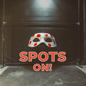 Miraculous Ladybug logo, vibrant and eye-catching design featuring a mask with red and black spots. Bold 'SPOTS ON!' text beneath. Against a sleek black backdrop.