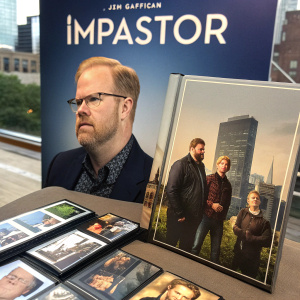 Promotional display for TV show 'Impastor'. Jim Gaffigan and cast members in various scenes. DVD and booklet materials arranged alongside.