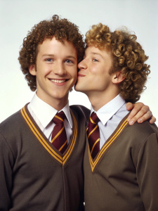 two cute smiling slender muscled curly high school guys in Hogwarts uniform kissing