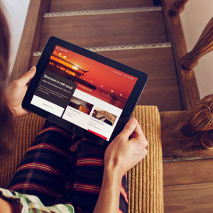 Eye-catching promotional site for AirAsia. Vibrant color palette. Red, black, and white. Interactive multimedia elements. Clear pricing and deals. User-friendly interface. Strong call to action.
