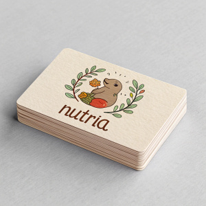 Stack of business cards for a local farm-to-table restaurant named Nutria. The cards are minimalist, featuring a custom logo of a nutria, an aquatic rodent. Cards have a warm, inviting color palette with a light gray background. Cards are professionally printed and neatly stacked.