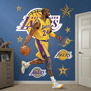 Wall featuring Fathead decal of Kobe Bryant. He's wearing Lakers jersey, surrounded by team logos and memorabilia. The background is blue