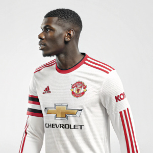 Paul Pogba's Manchester United home kit. Sleek long-sleeved jersey featuring bold white and red stripes, the iconic Adidas logo, and Chevrolet branding.