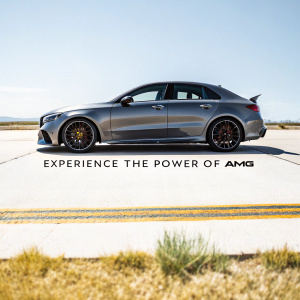 High-end image of a sleek, silver Mercedes-Benz A35 AMG parked on an open tarmac. Underneath it is a tagline 'Experience the Power of AMG'