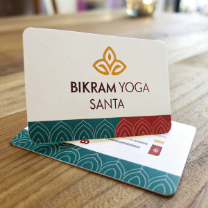 Custom business cards for Bikram Yoga Santa. Stylish logo, staff name, contact details in modern font. Bright background