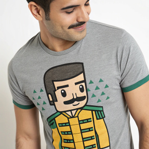 Freddie Mercury character T-shirt, cartoon style design. Gray, green, and yellow colors. Close-up photo, friendly expression, blocky structure, men's crew-neck, soft cotton texture.