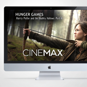 Interactive media hub showcasing movie trailers for 'Hunger Games' and 'Harry Potter and the Deathly Hallows: Part II'. Jennifer Lawrence as Katniss Everdeen in a forest scene with bow and arrow. Clean, modern interface with Cinemax logo.