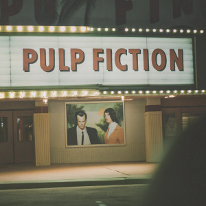 Vintage cinema billboard for 'Pulp Fiction'. Features John Travolta and Uma Thurman